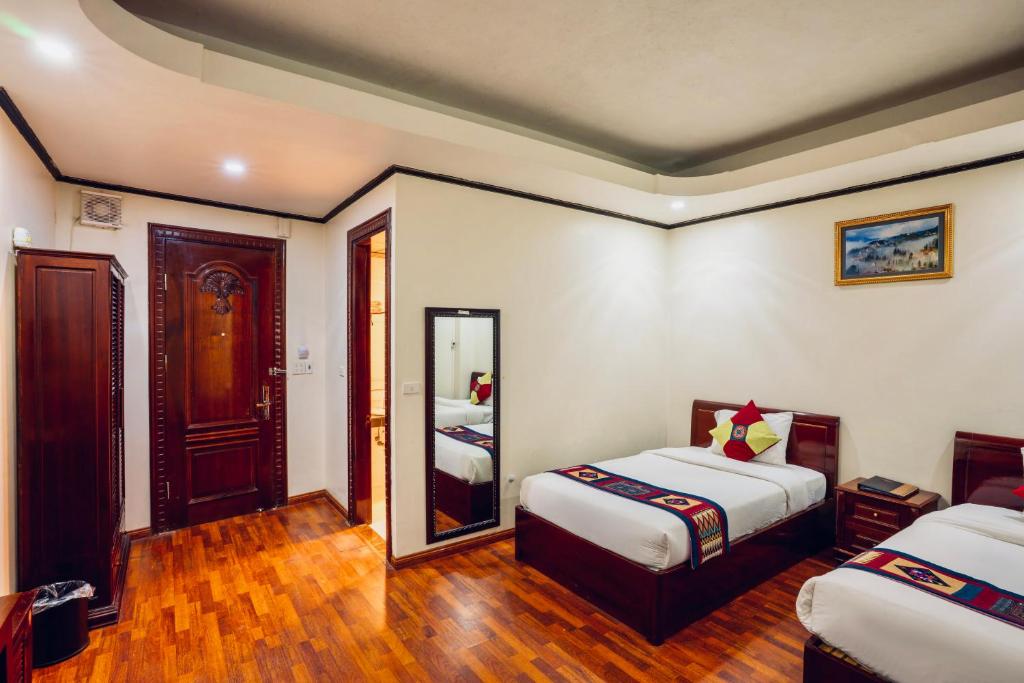 Phòng nghỉ ấm cúng tại Arengo Hotel & Travel